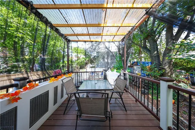 a view of a chairs and table in the balcony