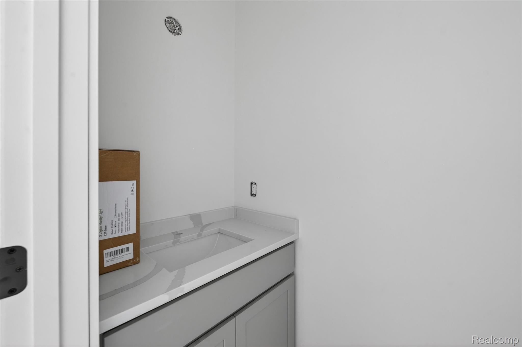 3297 Oak Grove Road Howell, MI 48855 - Photo 19 of 40 Stylish powder room with modern vanity and quartz countertop.