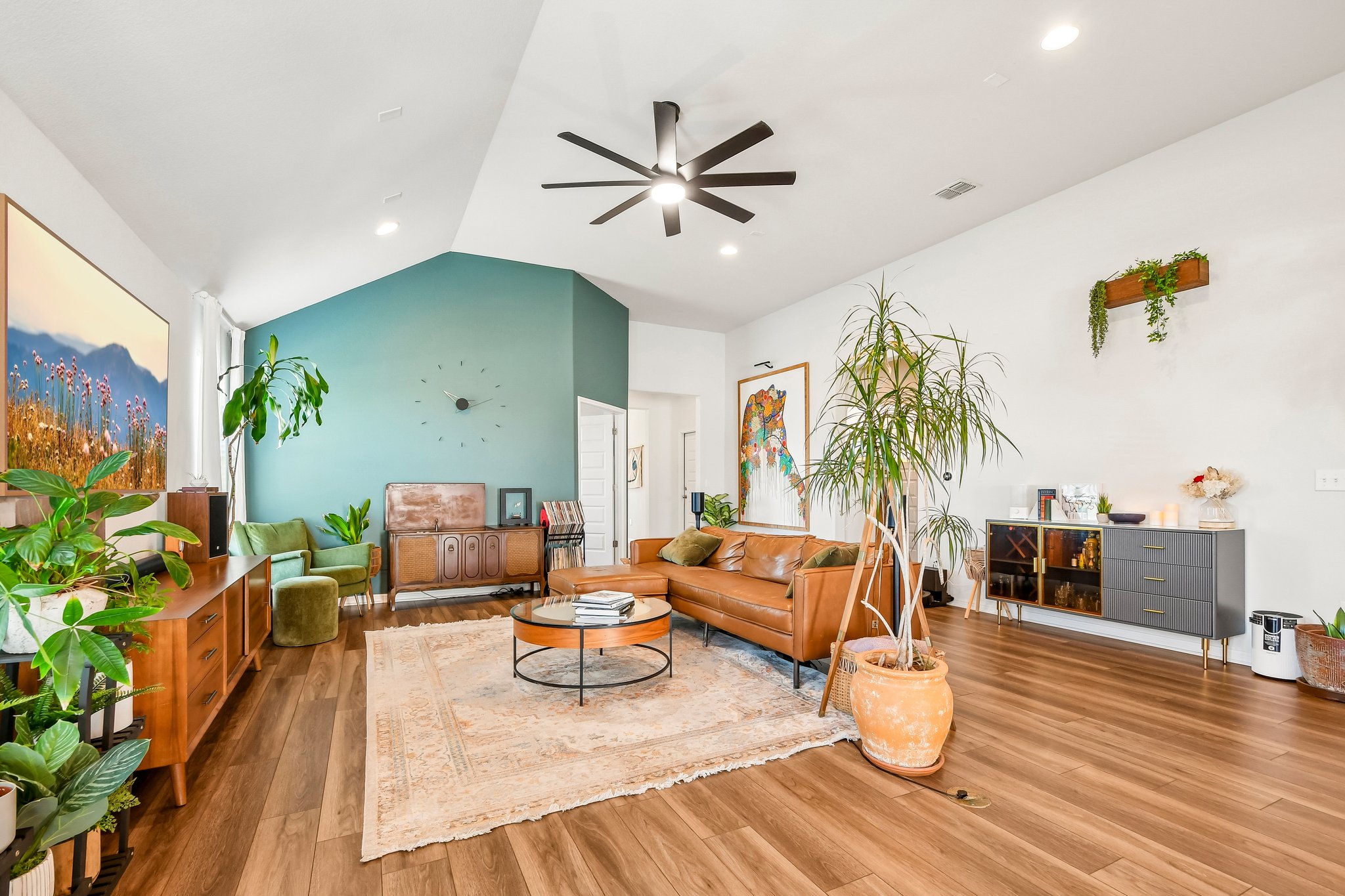 10700 Sentinel Drive Austin, TX 78747 - Photo 9 of 27 The accent wall creates a statement, doubling as a clock.