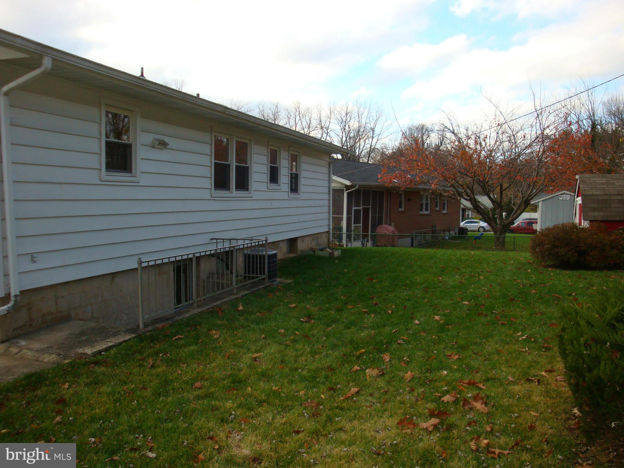 2414 Windsor Road Baltimore, MD 21234 - Photo 3 of 25 a view of a backyard with a garden