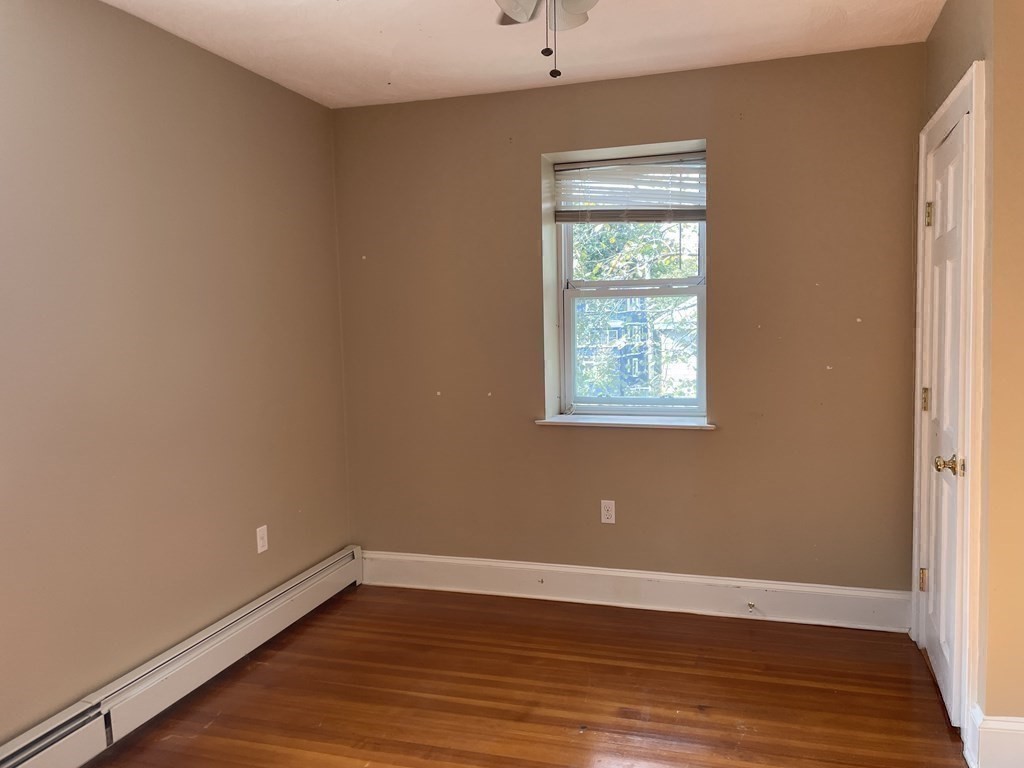 133 Fayerweather Street Cambridge, MA 02138 - Photo 13 of 27 a view of a room with wooden floor and windows