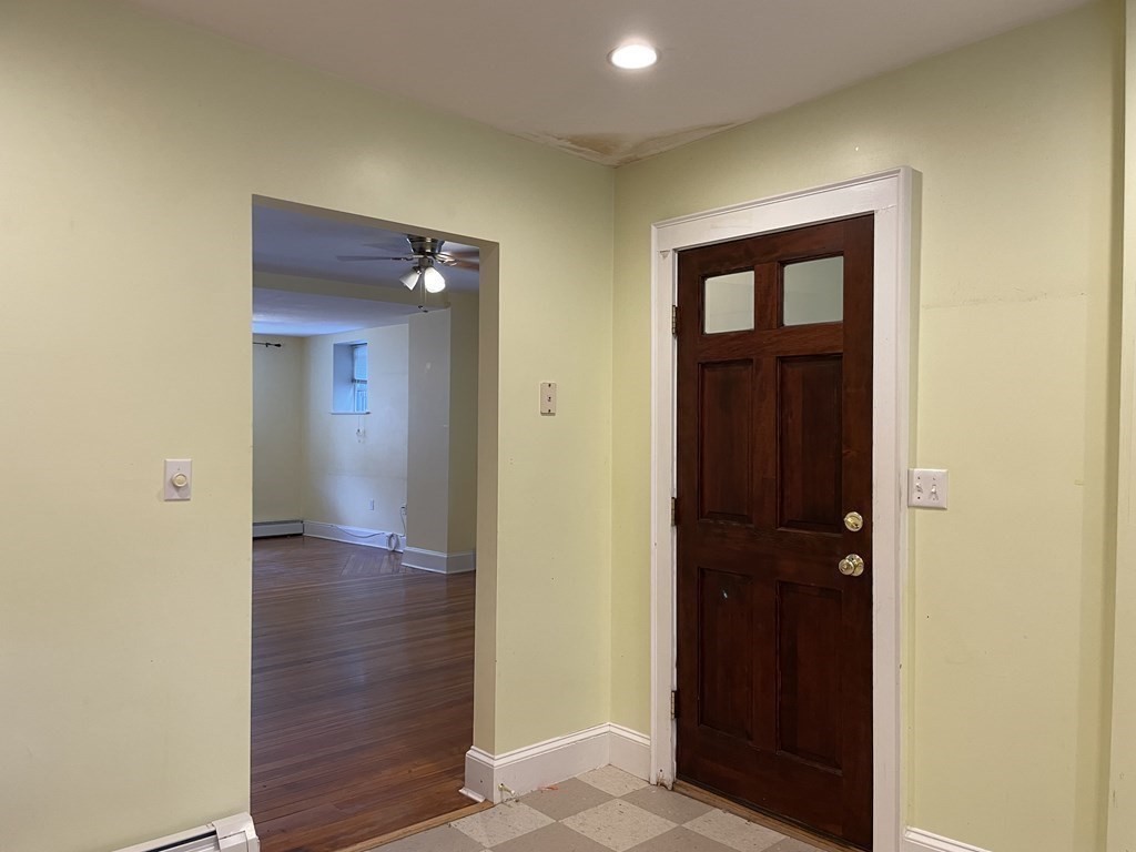 133 Fayerweather Street Cambridge, MA 02138 - Photo 8 of 27 a view of a hallway with wooden floor