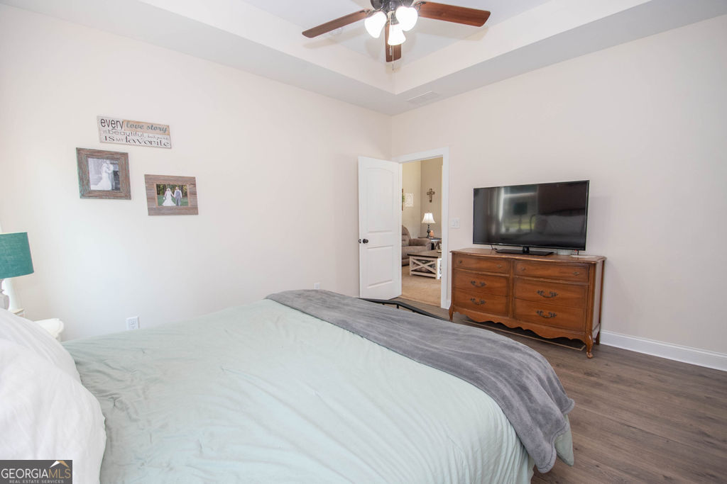 2046 Mcwilliams Barber Road Luthersville, GA 30251 - Photo 31 of 43 a bedroom with a bed and a flat screen tv