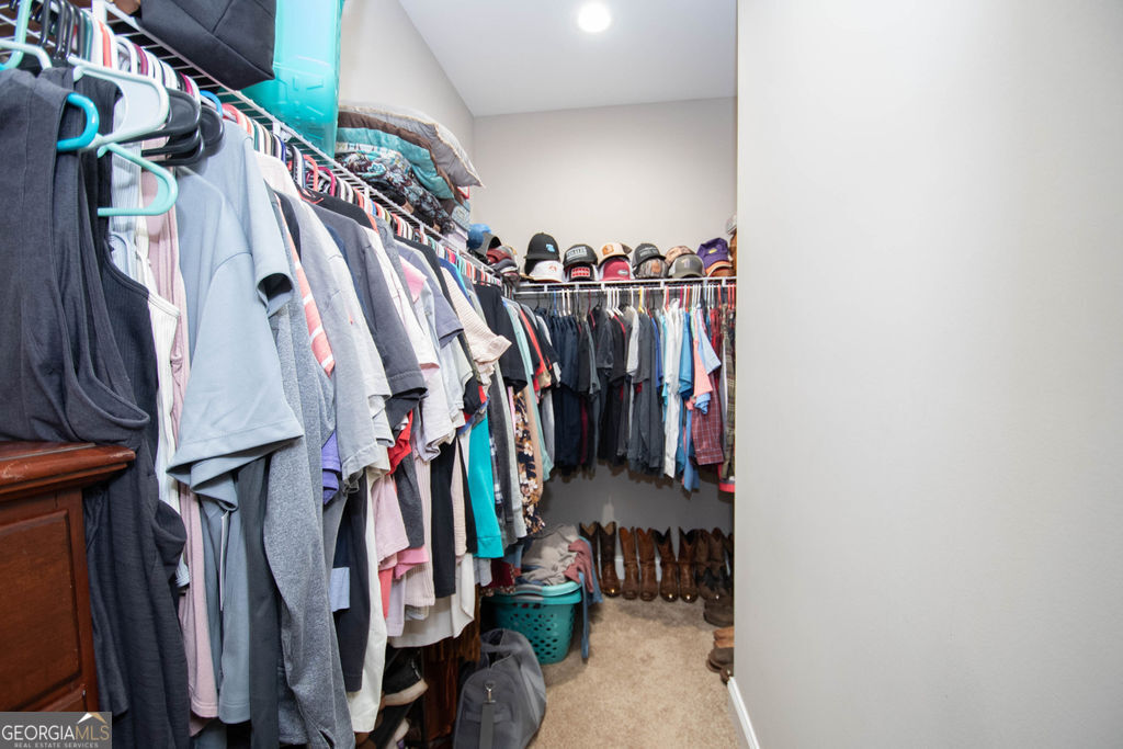 2046 Mcwilliams Barber Road Luthersville, GA 30251 - Photo 35 of 43 a view of walk in closet with clothes and shoes