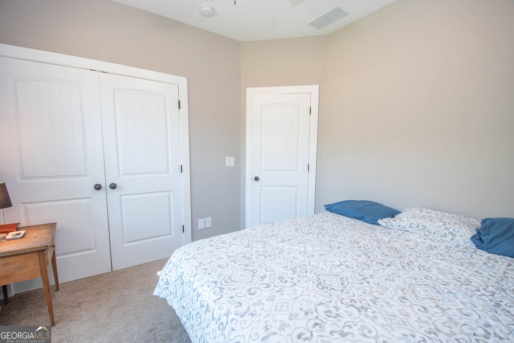 2046 Mcwilliams Barber Road Luthersville, GA 30251 - Photo 37 of 43 a bedroom with a bed and a cabinets