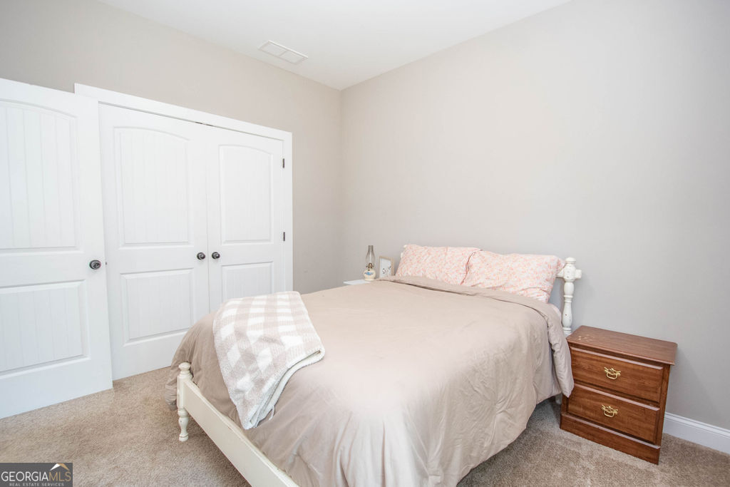 2046 Mcwilliams Barber Road Luthersville, GA 30251 - Photo 40 of 43 a bedroom with a bed and a window