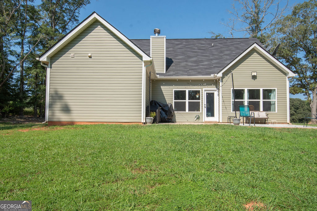 2046 Mcwilliams Barber Road Luthersville, GA 30251 - Photo 8 of 43 a view of a house with backyard