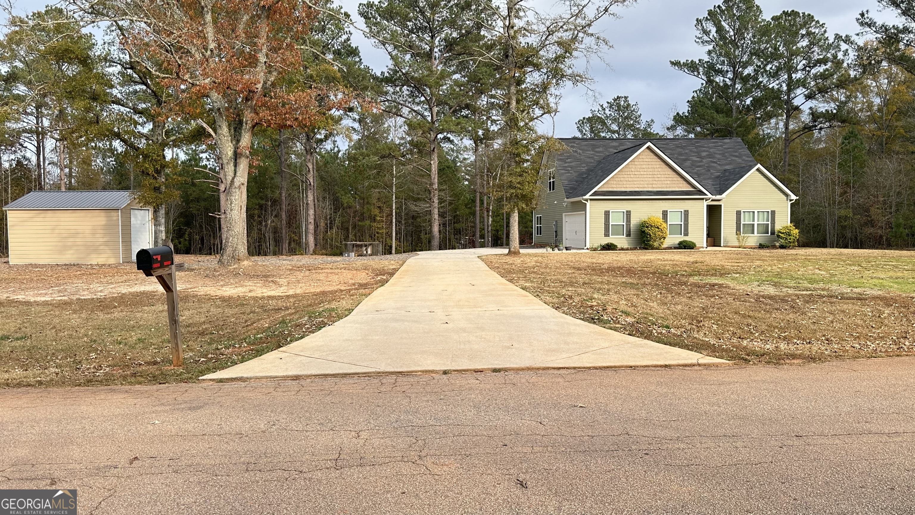 2046 Mcwilliams Barber Road Luthersville, GA 30251 - Photo 9 of 43 a front view of a house with garden