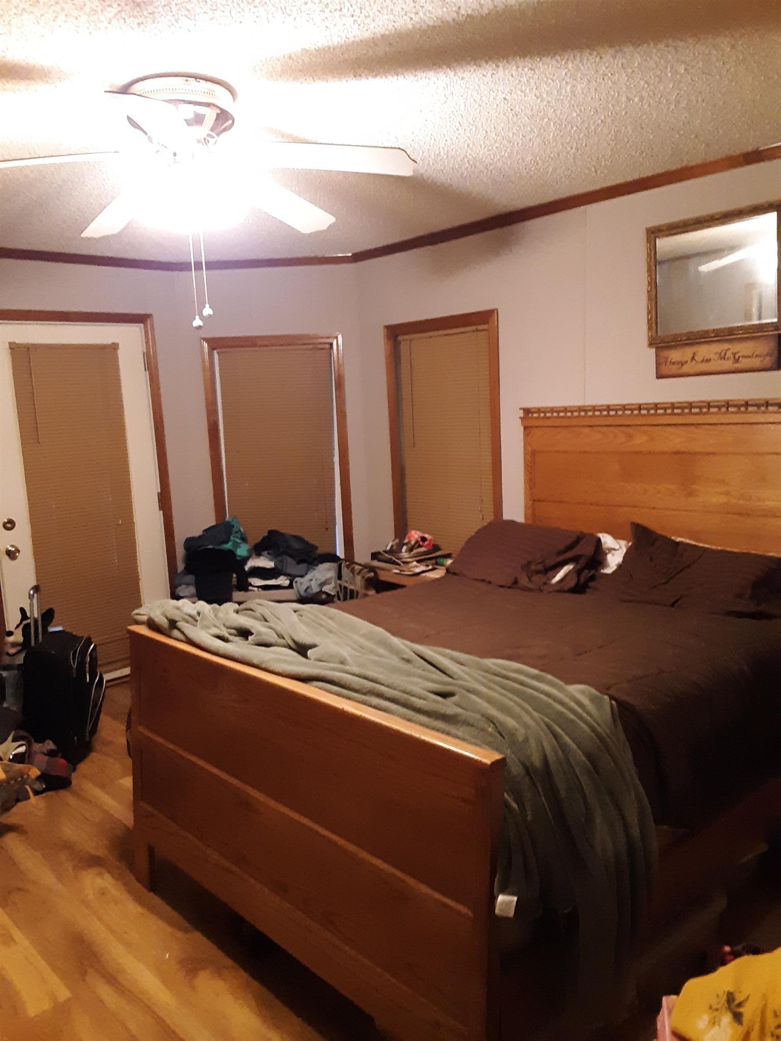289 Ray Jent Road Bethpage, TN 37022 - Photo 11 of 19 a bed room with a bed and a night stand