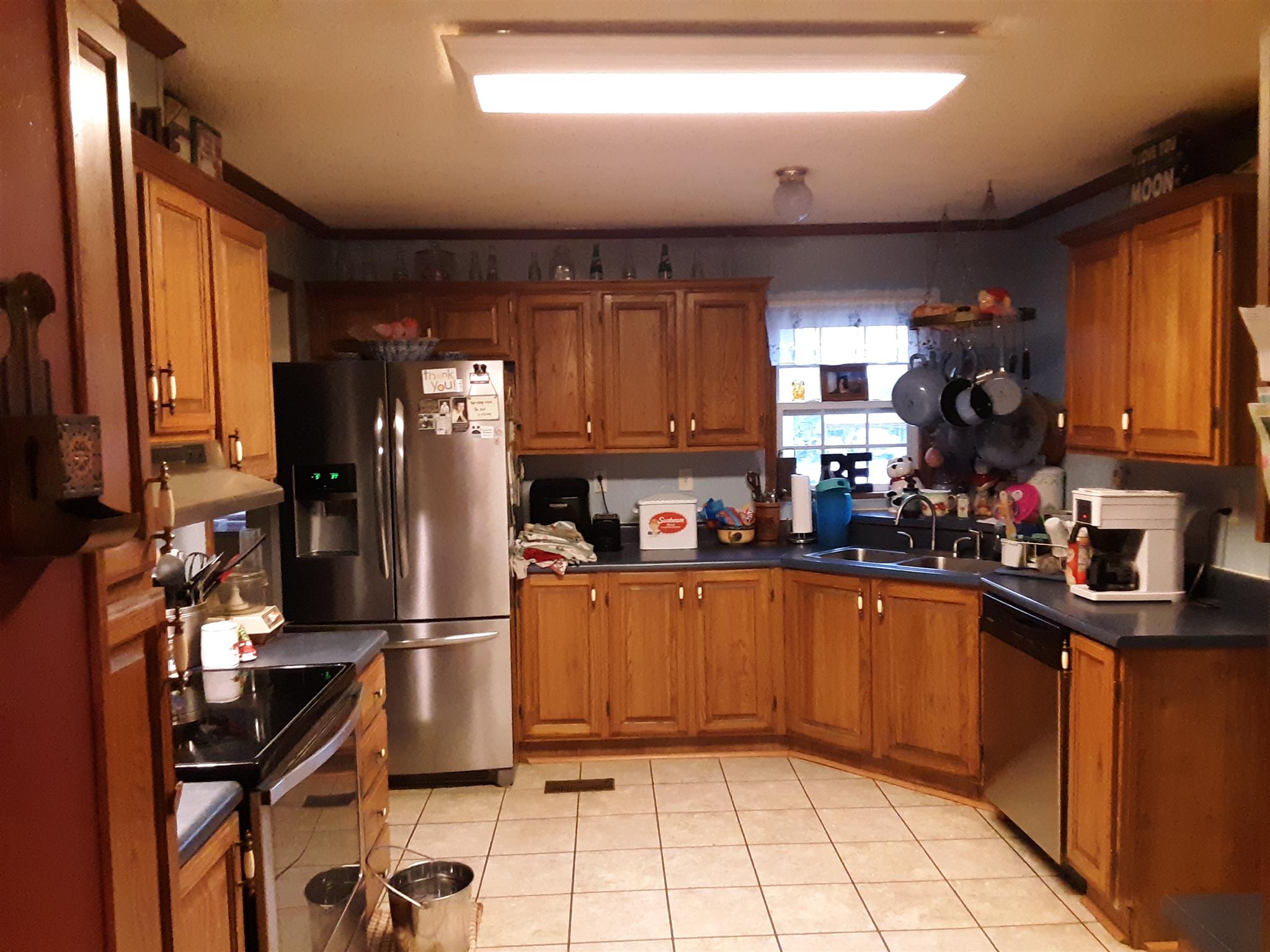 289 Ray Jent Road Bethpage, TN 37022 - Photo 10 of 19 a kitchen with a sink refrigerator and cabinets