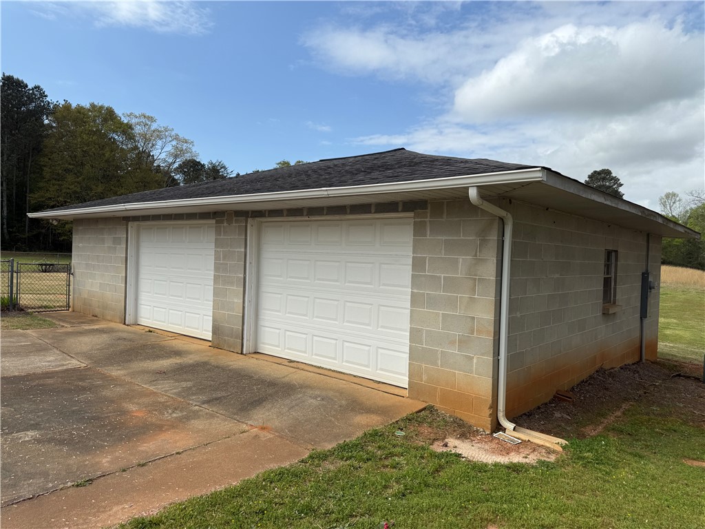 121 Nautical Way Anderson, SC 29625 - Photo 35 of 37 A detached two-car garage crafted from concrete block offers secure parking and ample storage space.
