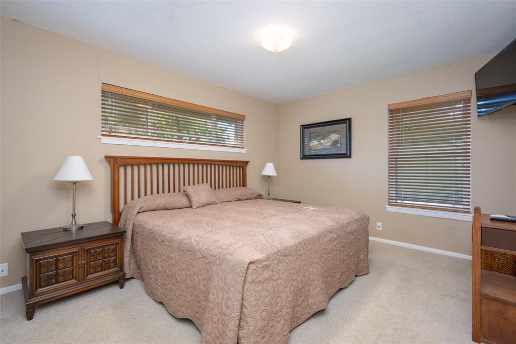 1027 Stanley Street Denton, TX 76201 - Photo 22 of 38 a bedroom with a bed and a window
