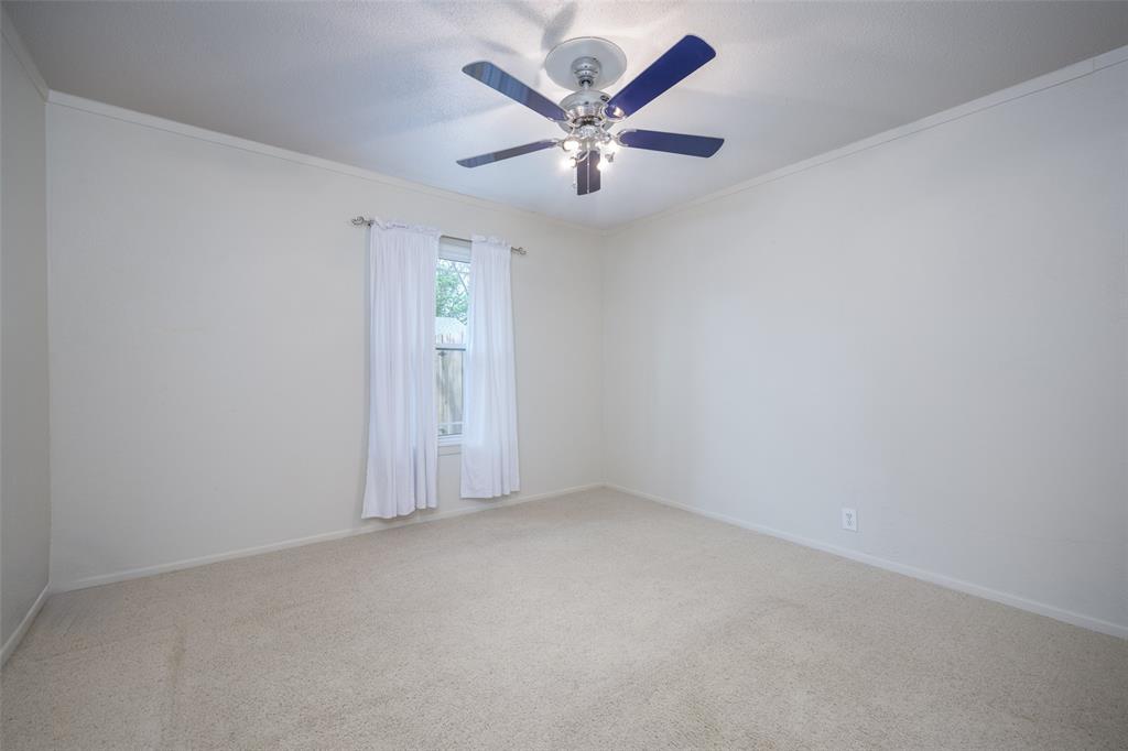 1027 Stanley Street Denton, TX 76201 - Photo 26 of 38 an empty room with closet and ceiling fan