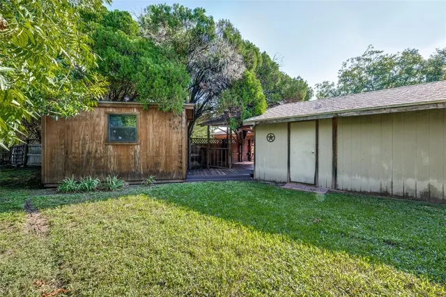 a backyard of a house with lots of green space