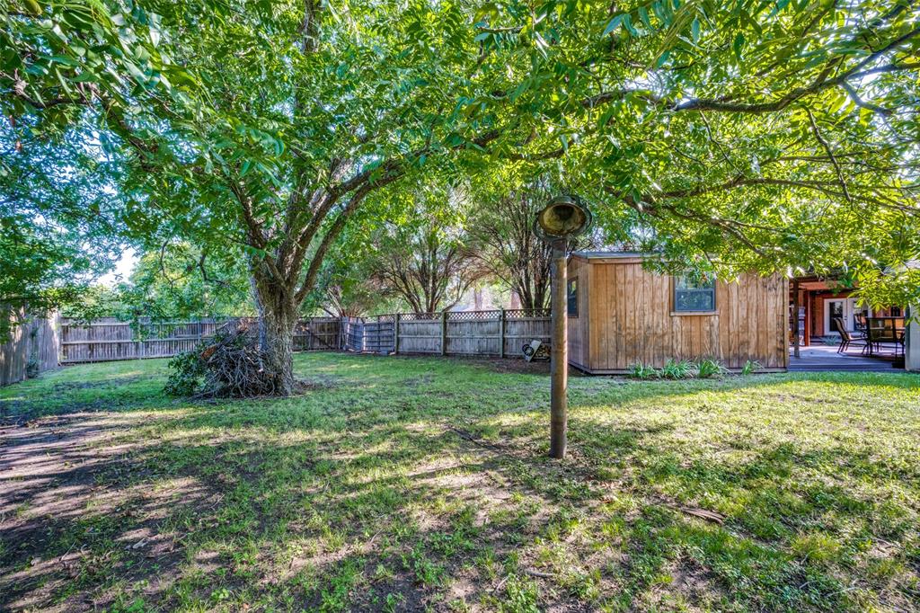 1027 Stanley Street Denton, TX 76201 - Photo 34 of 38 a view of a house with a yard