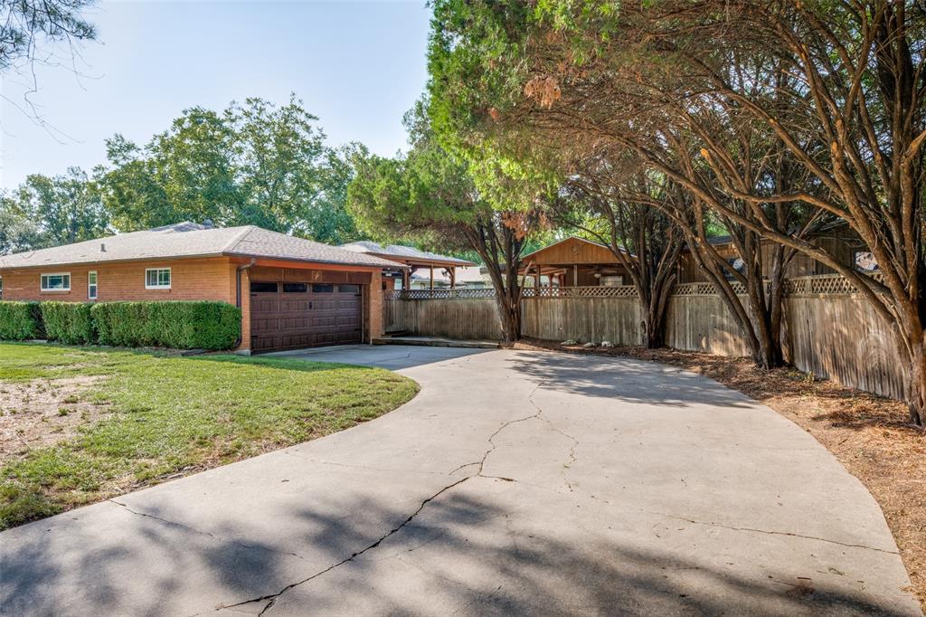 1027 Stanley Street Denton, TX 76201 - Photo 37 of 38 a view of a house with a yard