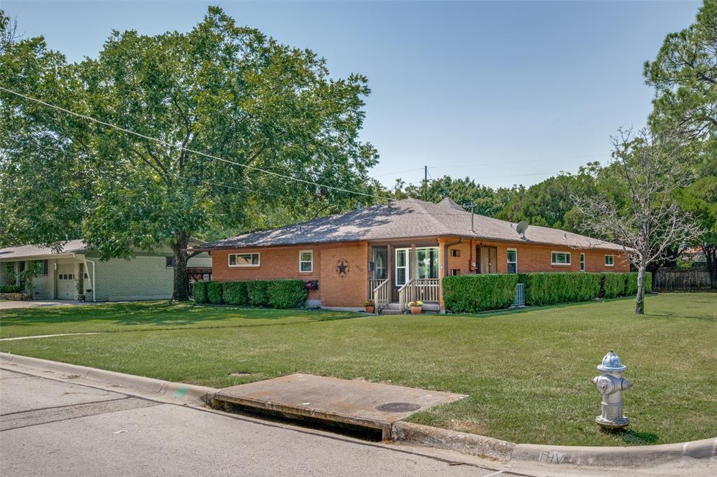 1027 Stanley Street Denton, TX 76201 - Photo 5 of 38 a view of a house with a yard