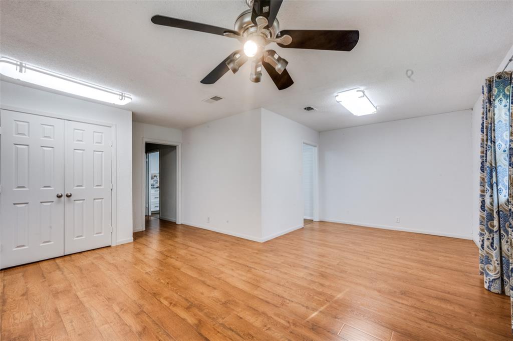 1027 Stanley Street Denton, TX 76201 - Photo 6 of 38 a view of an empty room and chandelier fan