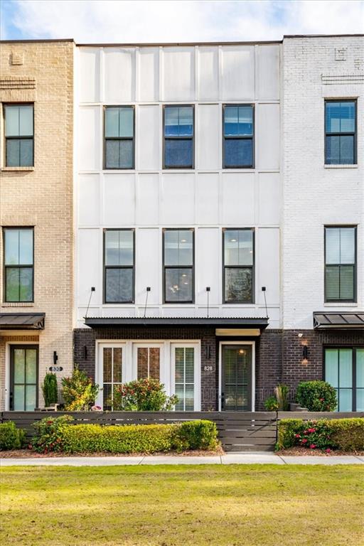 a front view of a building with a swimming pool