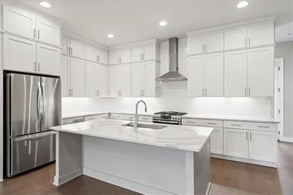 a kitchen with a sink and a refrigerator