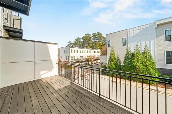 a view of a balcony with wooden floor