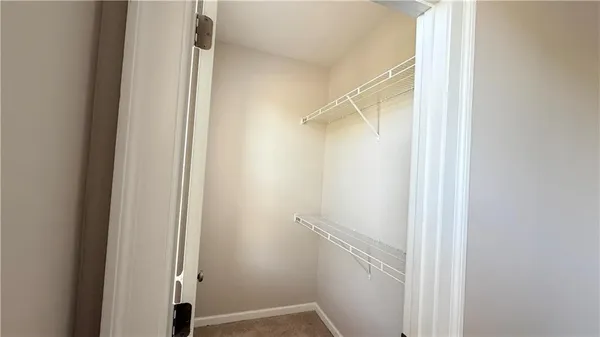a bathroom with a sink a toilet and shower curtain
