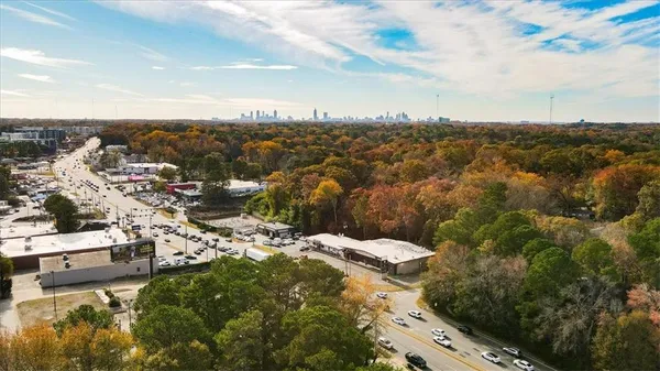 an aerial view of residential building with trees