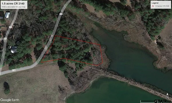 a view of a lake with a yard