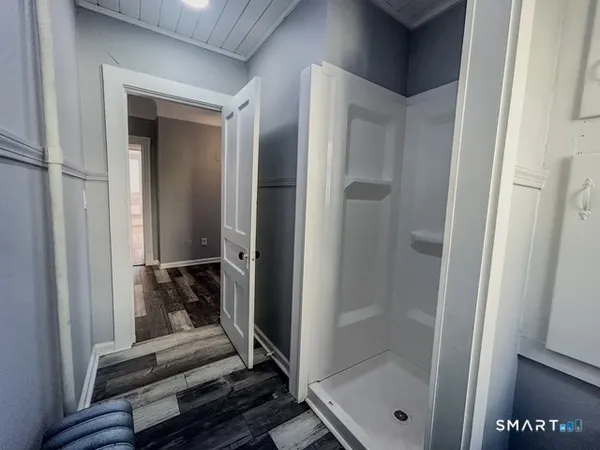 a bathroom with a glass shower door