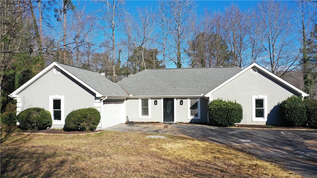 1985 Golden Ridge Circle Cumming, GA 30040 - Photo 1 of 1 a view of a white house next to a yard and large trees