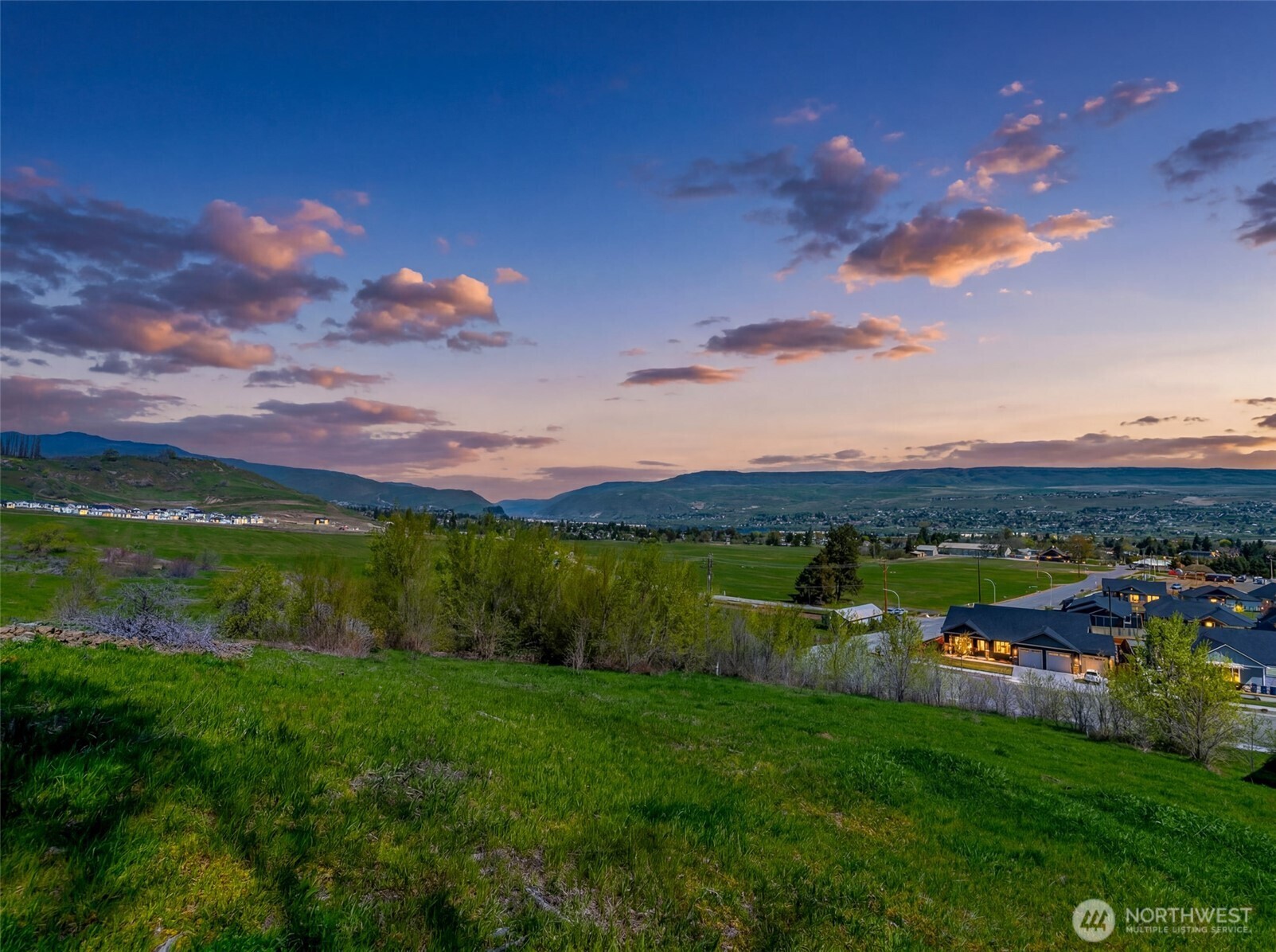 935 Silas Lane Wenatchee, WA 98801 - Photo 10 of 24 a view of a lake with houses in the back