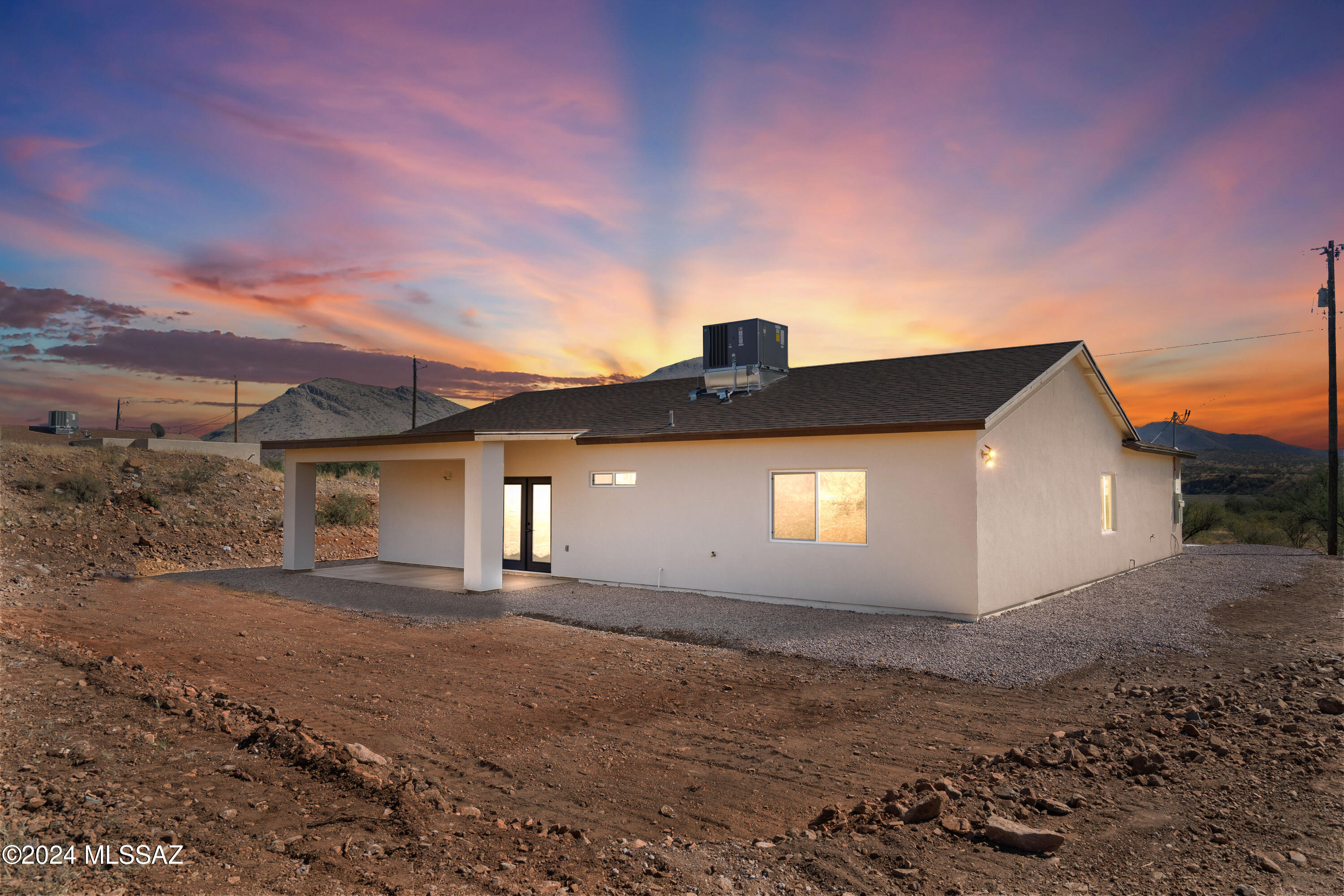 1874 Circulo Colombia Rio Rico, AZ 85648 - Photo 4 of 31 a front view of a house with a yard and garage