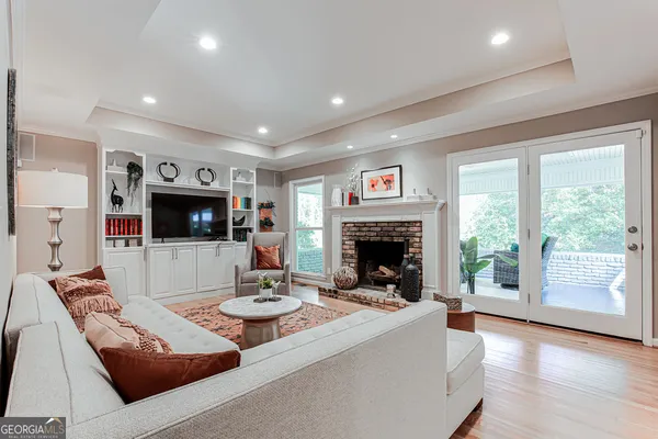 a living room with furniture and a fireplace
