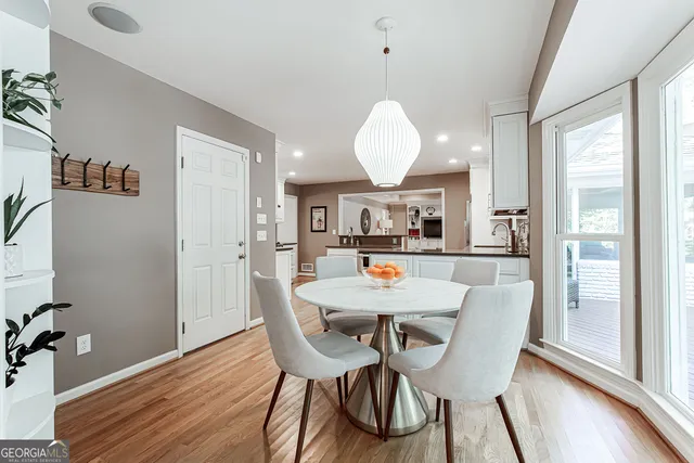 a view of a dining room with furniture window and wooden floor