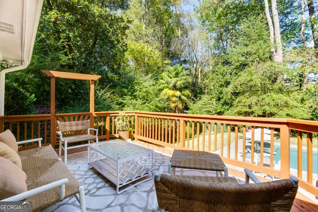 a view of a chair and table in the balcony