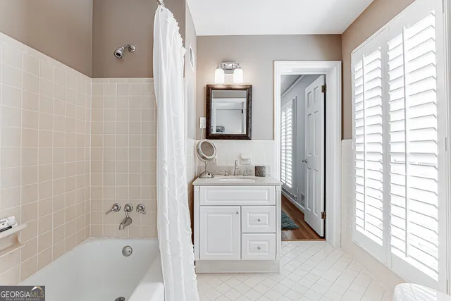 a bathroom with a sink a toilet and a bathtub