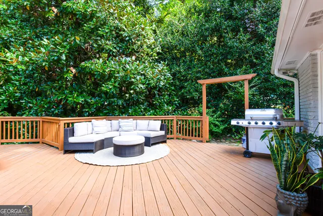 a view of balcony with furniture and wooden floor