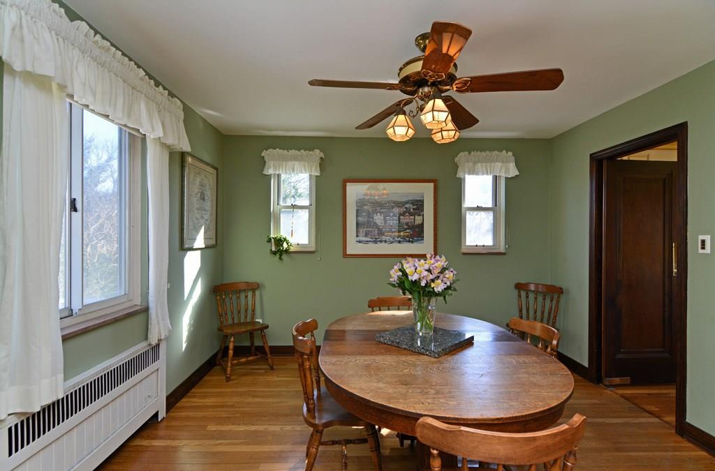 130 Harding Road Pittsburgh, PA 15229 - Photo 7 of 23 Classic hardwood flooring underscores the formal dining room, also offering a lighted ceiling fan and easy kitchen access.