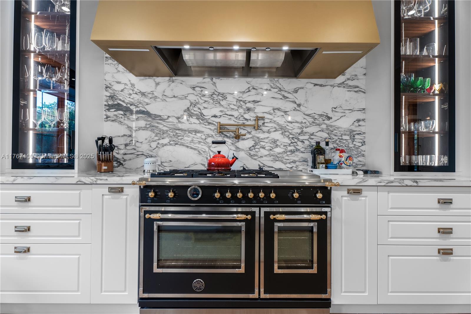 6575 Southwest 96th Street Pinecrest, FL 33156 - Photo 27 of 95 a stove top oven sitting inside of a kitchen