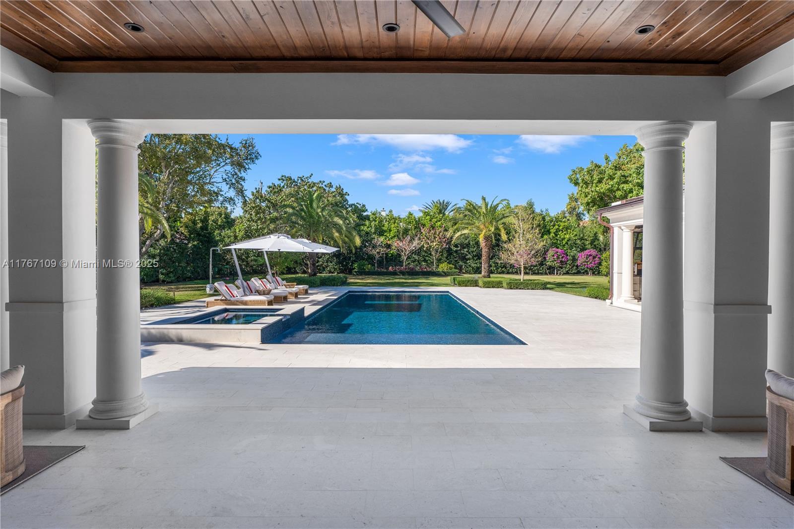 6575 Southwest 96th Street Pinecrest, FL 33156 - Photo 44 of 95 a view of swimming pool from a balcony