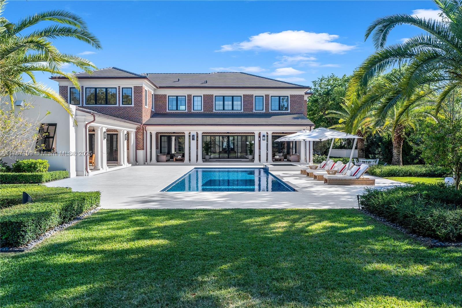 6575 Southwest 96th Street Pinecrest, FL 33156 - Photo 48 of 95 a view of a house with a swimming pool