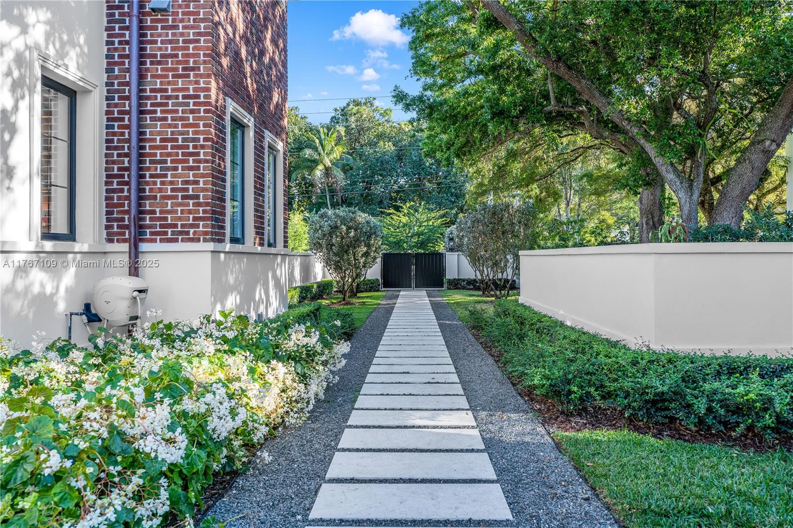 6575 Southwest 96th Street Pinecrest, FL 33156 - Photo 54 of 95 a view of a pathway both side of the house