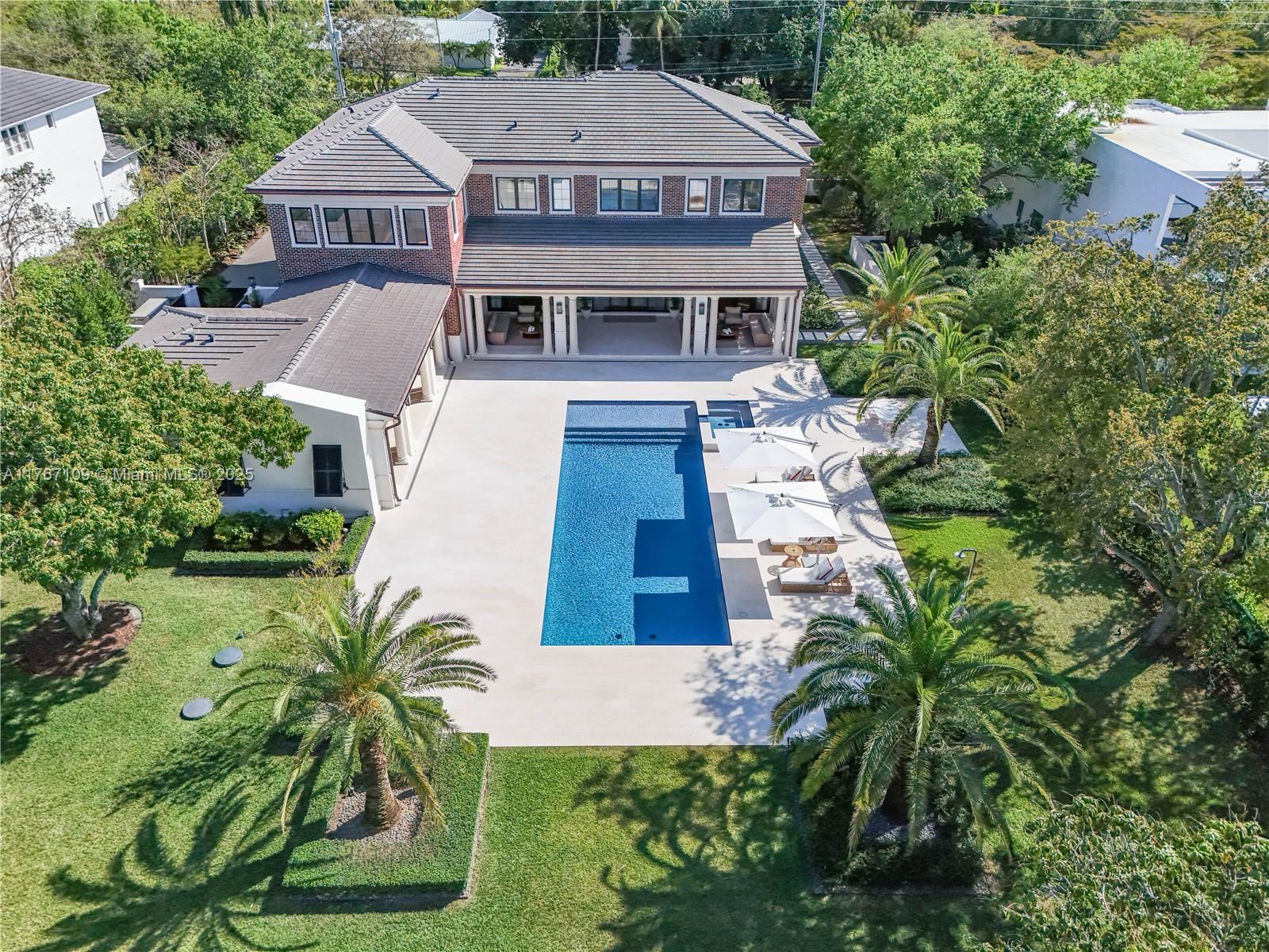 6575 Southwest 96th Street Pinecrest, FL 33156 - Photo 73 of 95 a aerial view of a house with a yard