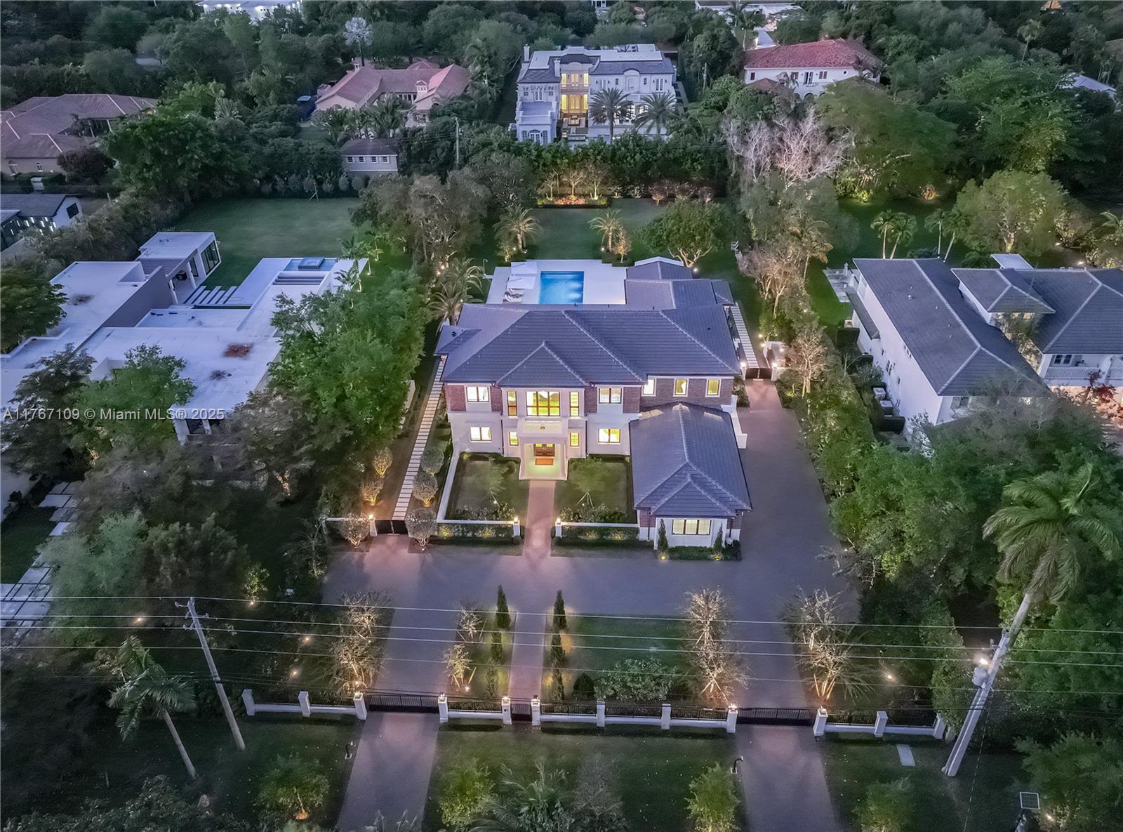 6575 Southwest 96th Street Pinecrest, FL 33156 - Photo 75 of 95 an aerial view of house with swimming pool outdoor seating and yard