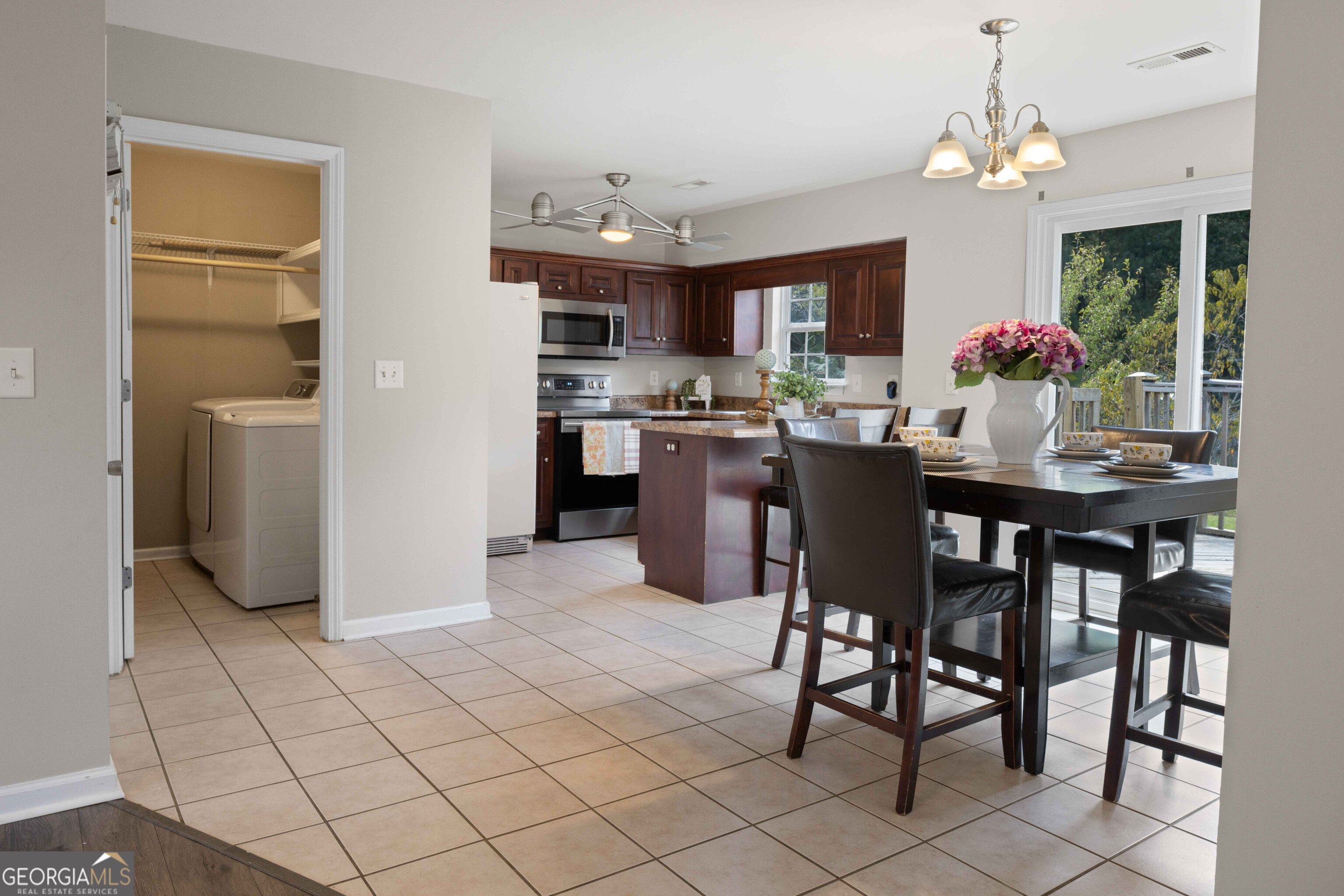 33 Northwest Hunters Glenn Road Rome, GA 30165 - Photo 8 of 43 a dining room filled chandelier and kitchen view