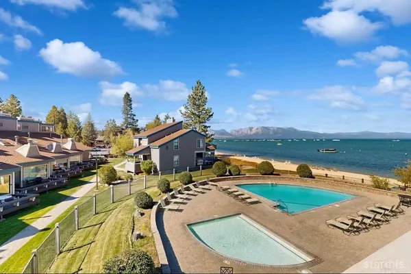 a view of a swimming pool with a lake view