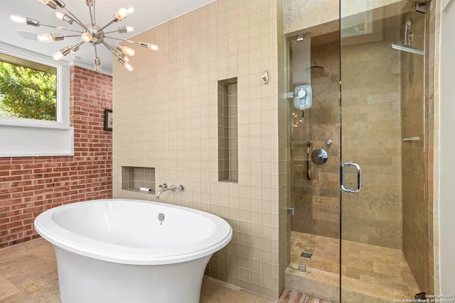 a bathroom with a bathtub and shower