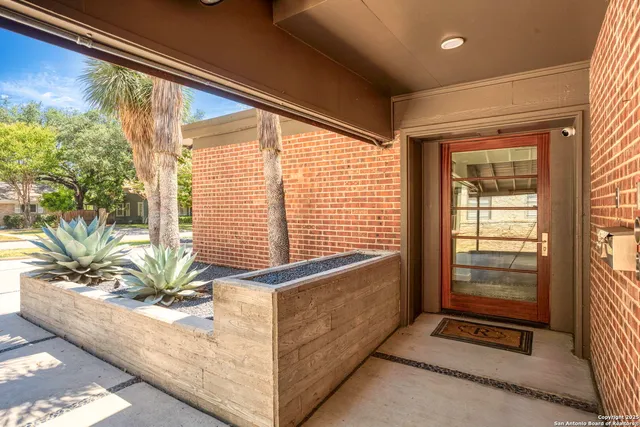 a view of entryway with wooden floor and a potted plant