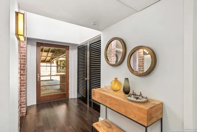 a clock on a wall next to a window