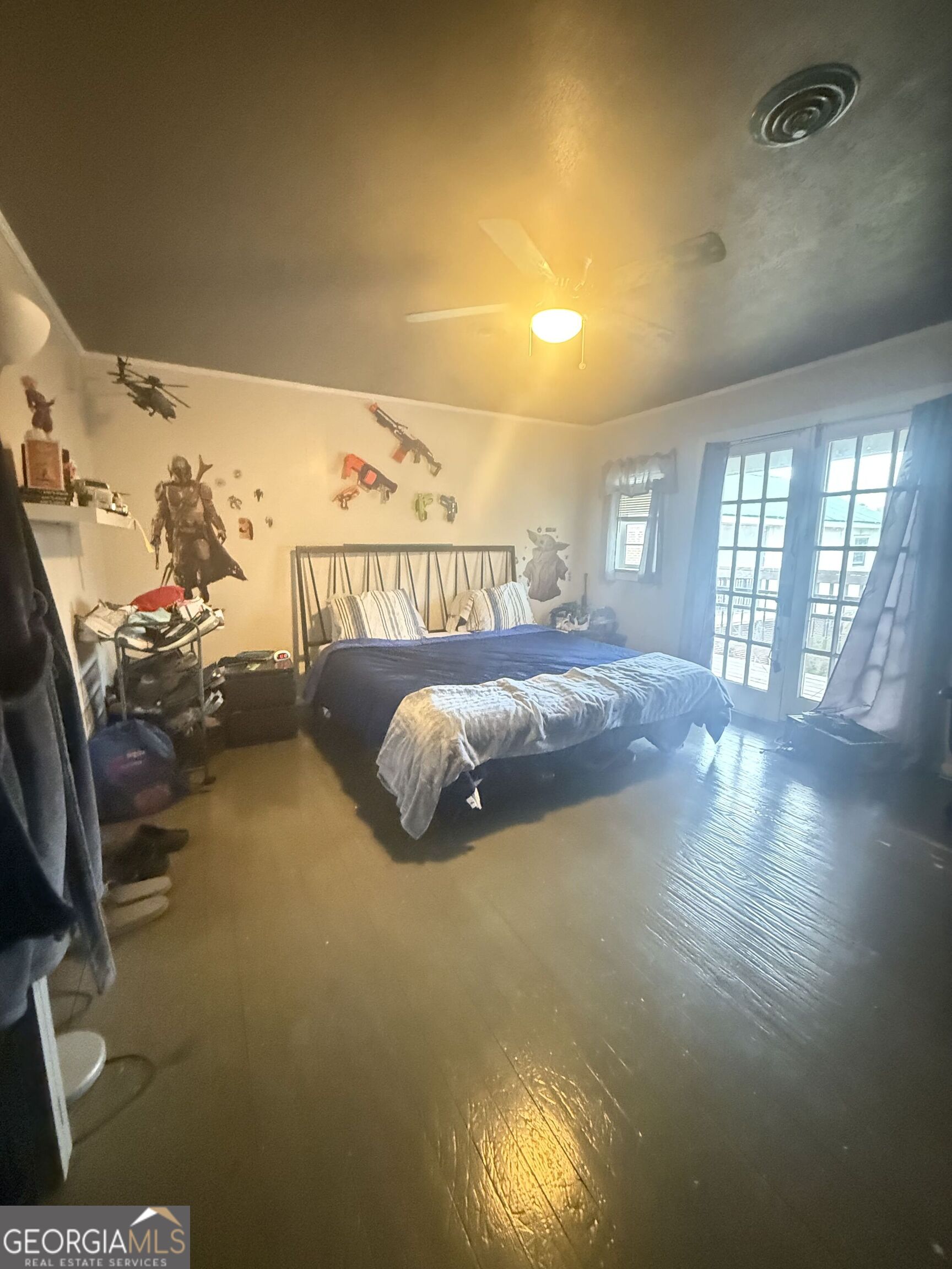 3861 Newnan Road Griffin, GA 30223 - Photo 49 of 89 a bed sitting in a bedroom next to a window